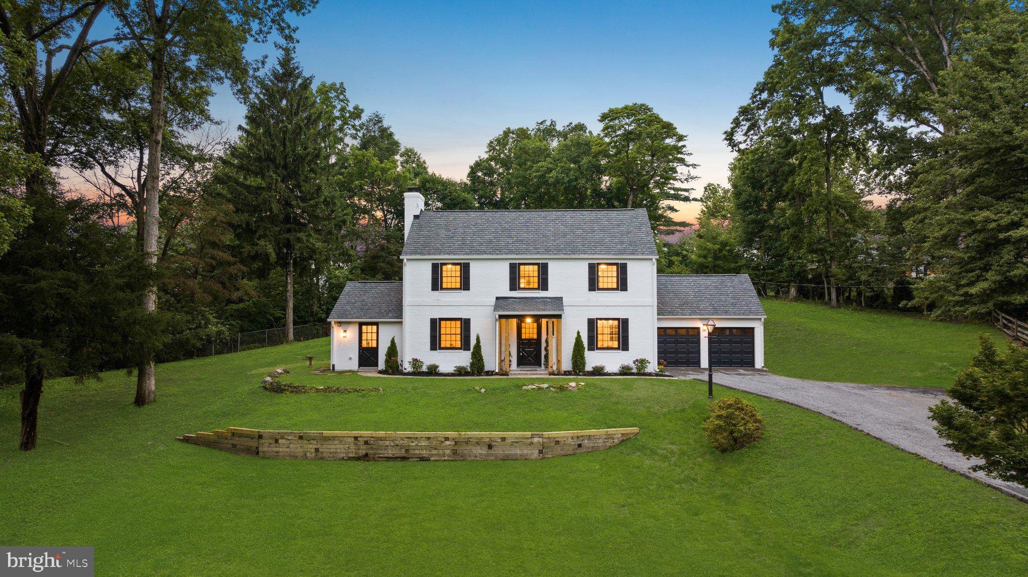 7819 Overbrook Road Ruxton, MD 21204 - Photo 6 of 80 a view of a house with a big yard and large trees