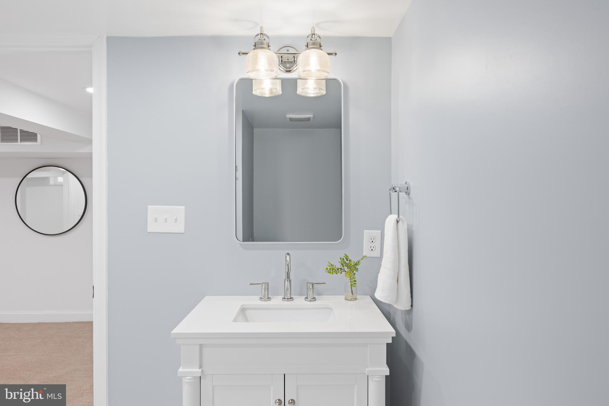 7819 Overbrook Road Ruxton, MD 21204 - Photo 66 of 80 a bathroom with a sink vanity and a mirror