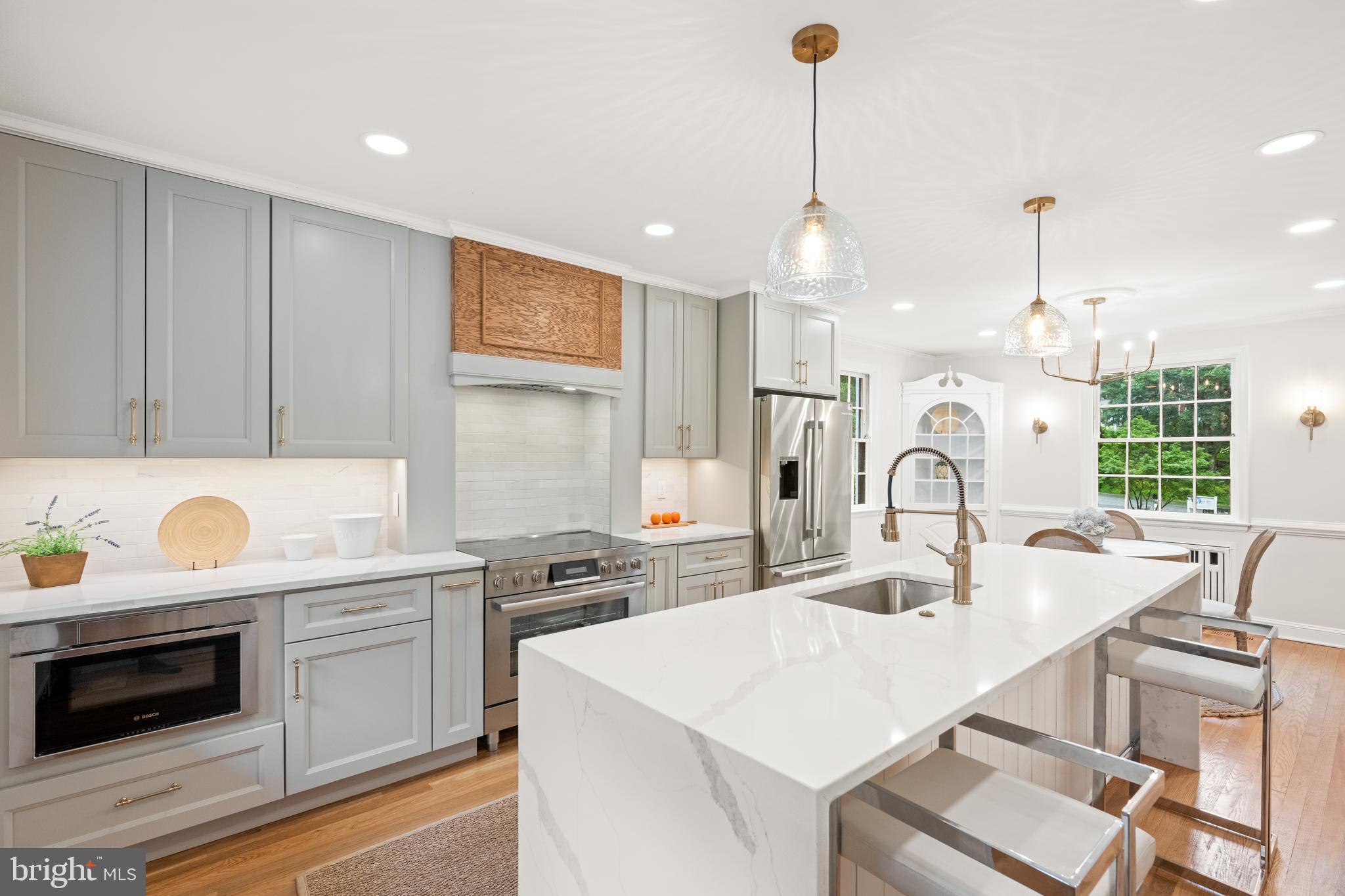 7819 Overbrook Road Ruxton, MD 21204 - Photo 9 of 80 a kitchen with a sink a stove a microwave and island