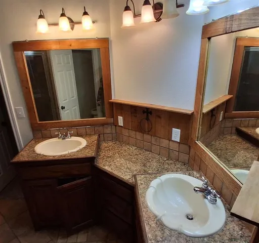 a bathroom with a bathtub and shower