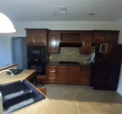 a room with furniture and a potted plant