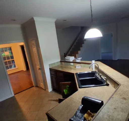 a kitchen with a stove and a refrigerator