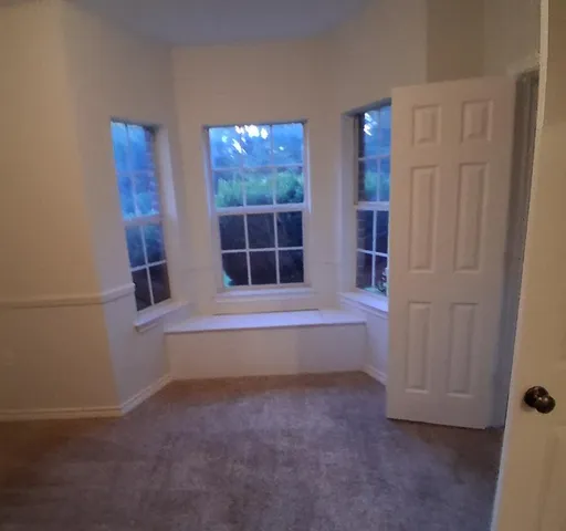 a spacious bathroom with a bathtub and shower