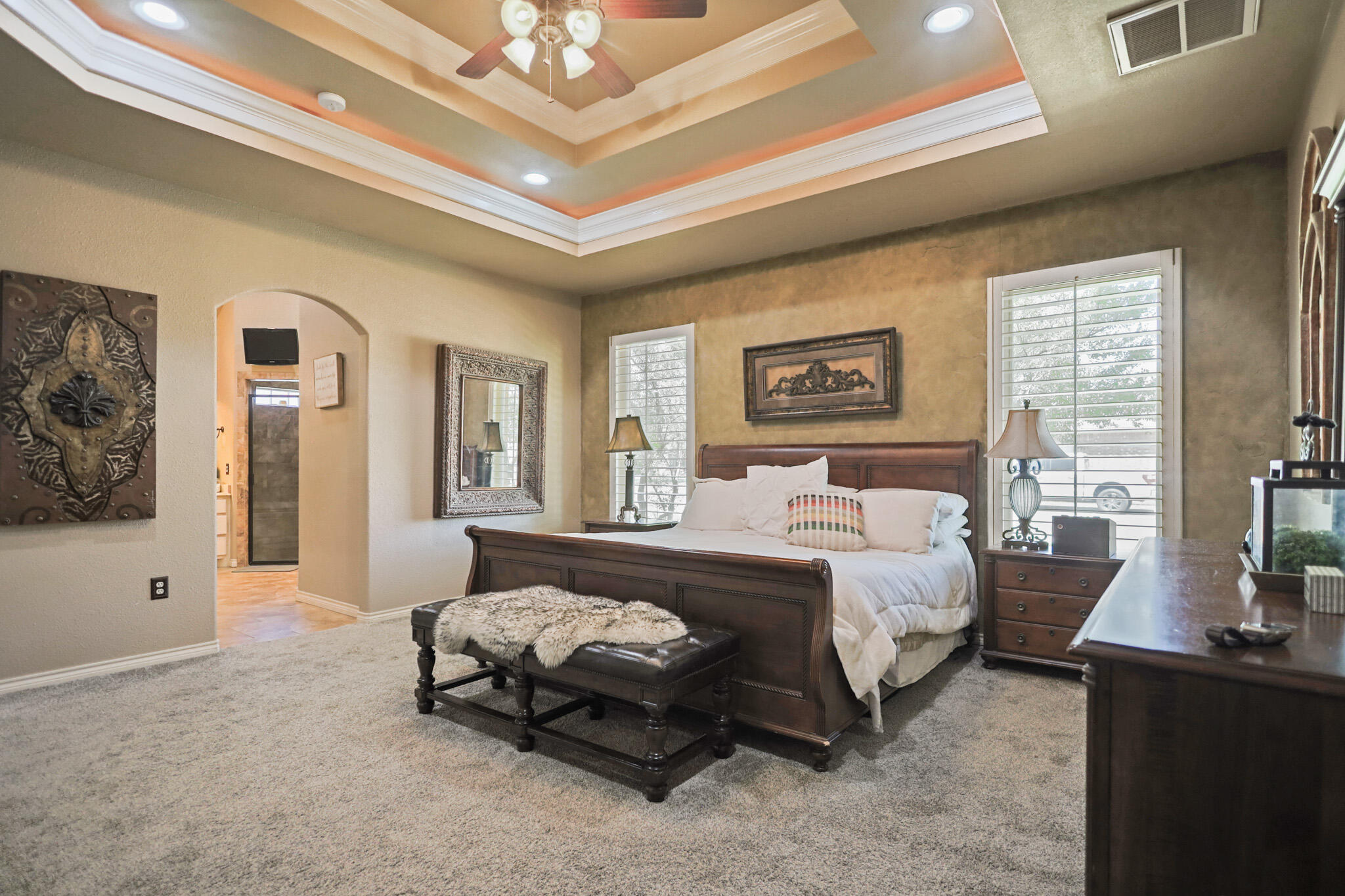 6005 93rd Street Lubbock, TX 79424 - Photo 11 of 31 a spacious bedroom with a bed couch and window