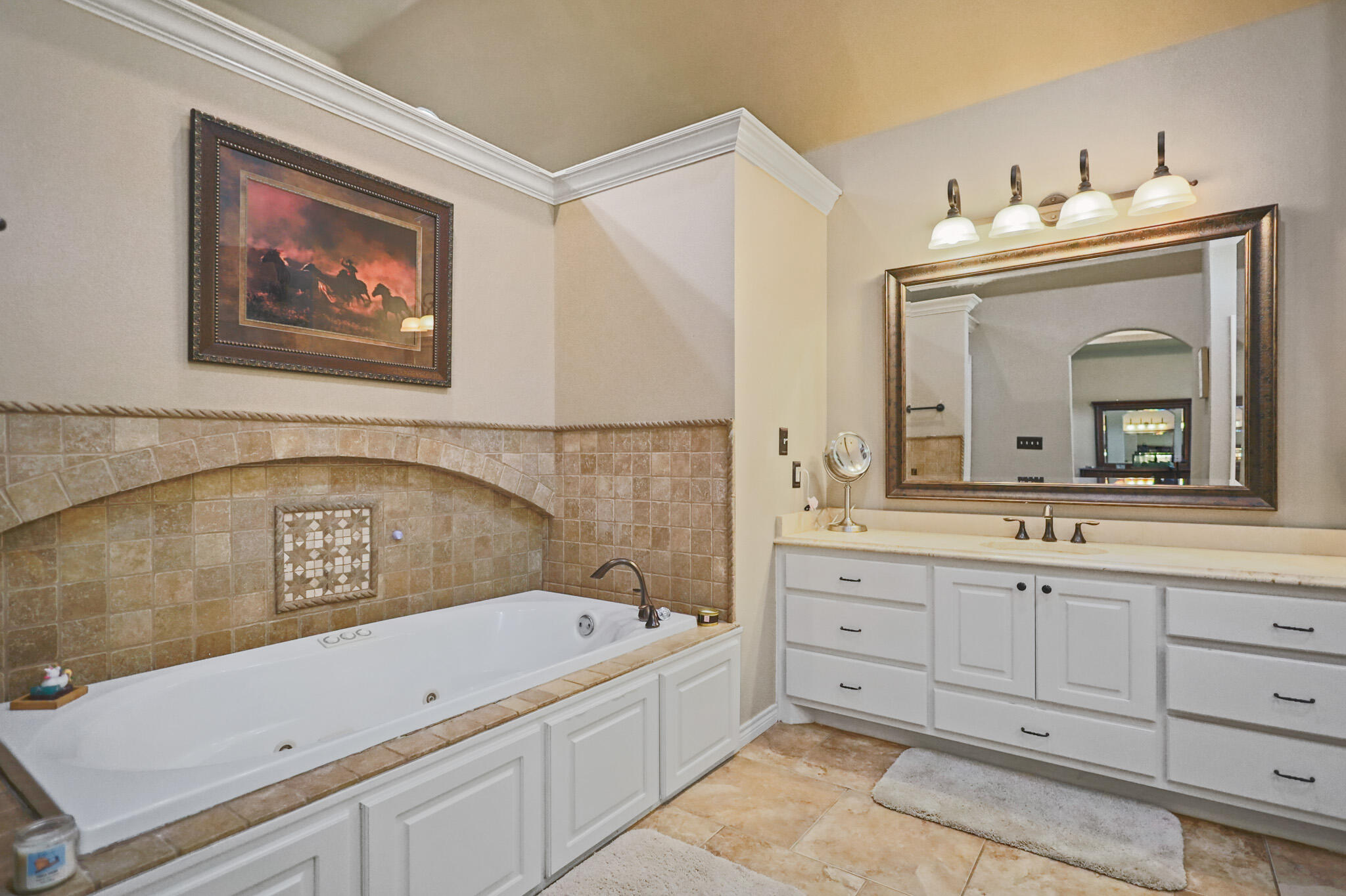 6005 93rd Street Lubbock, TX 79424 - Photo 12 of 31 a bathroom with a bathtub sink and mirror