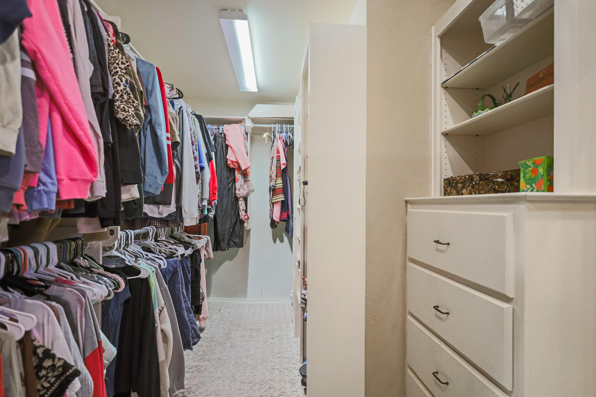 6005 93rd Street Lubbock, TX 79424 - Photo 16 of 31 a view of walk in closet with clothes