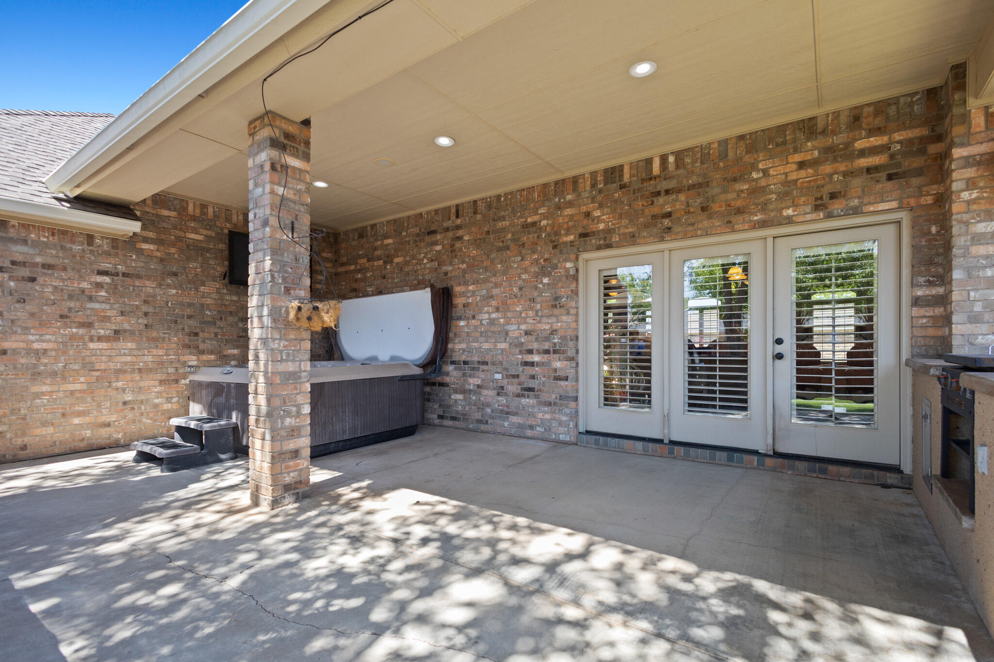 6005 93rd Street Lubbock, TX 79424 - Photo 26 of 31 a view of a porch with a table and chairs