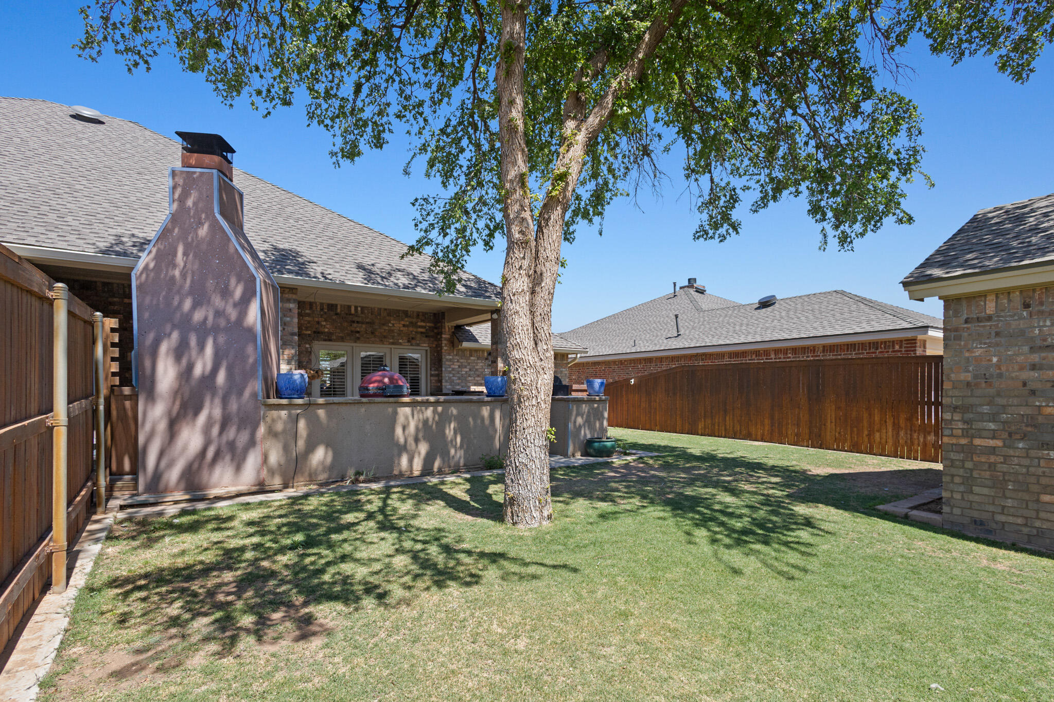 6005 93rd Street Lubbock, TX 79424 - Photo 29 of 31 a front view of a house with garden