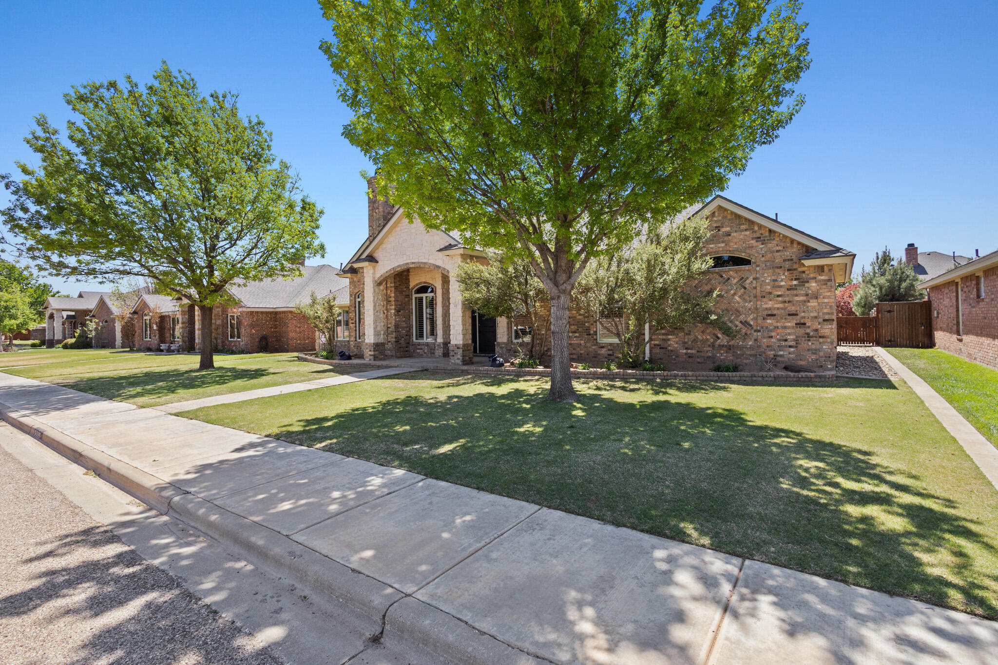 6005 93rd Street Lubbock, TX 79424 - Photo 3 of 31 a view of yard with swimming pool and green space