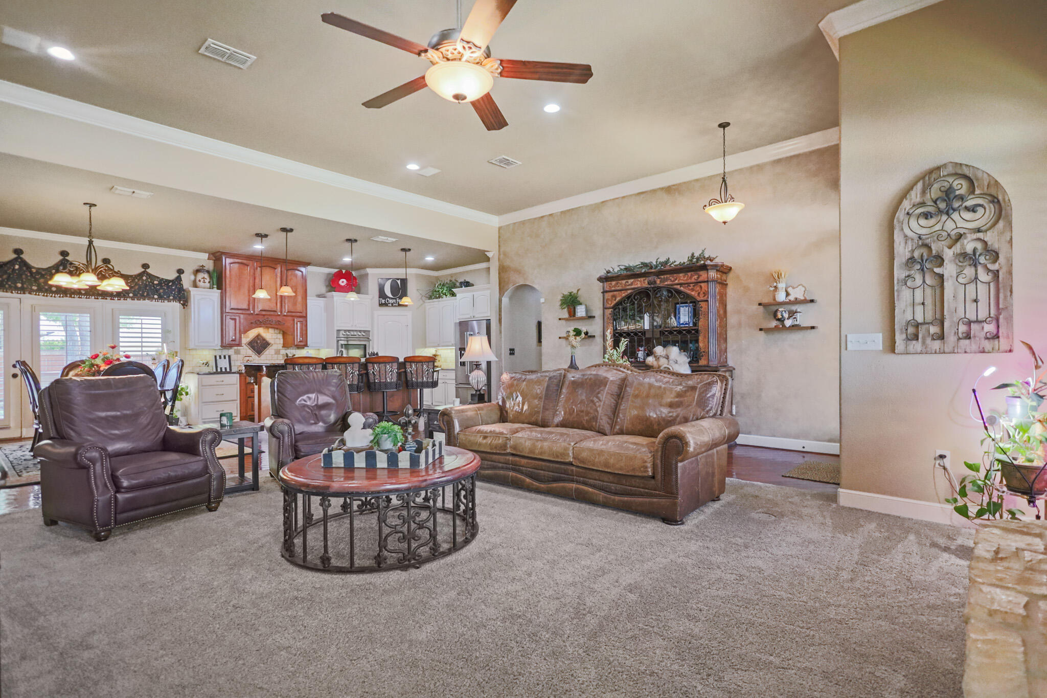 6005 93rd Street Lubbock, TX 79424 - Photo 6 of 31 a living room with furniture and a chandelier