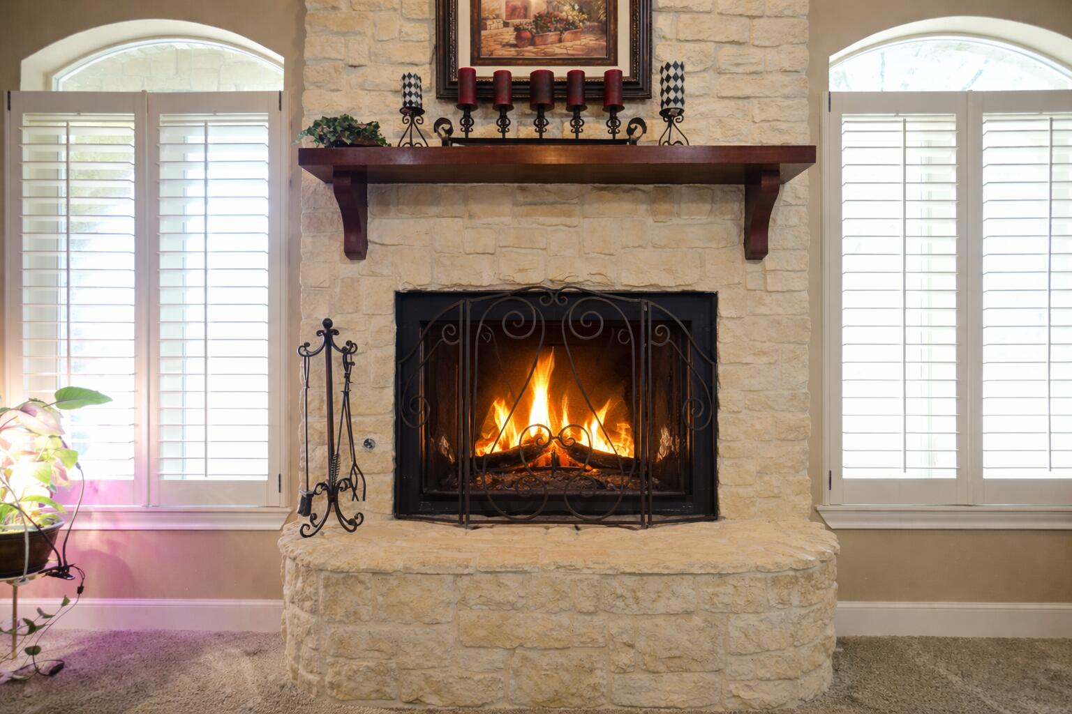 6005 93rd Street Lubbock, TX 79424 - Photo 7 of 31 a living room with a fireplace and a windows