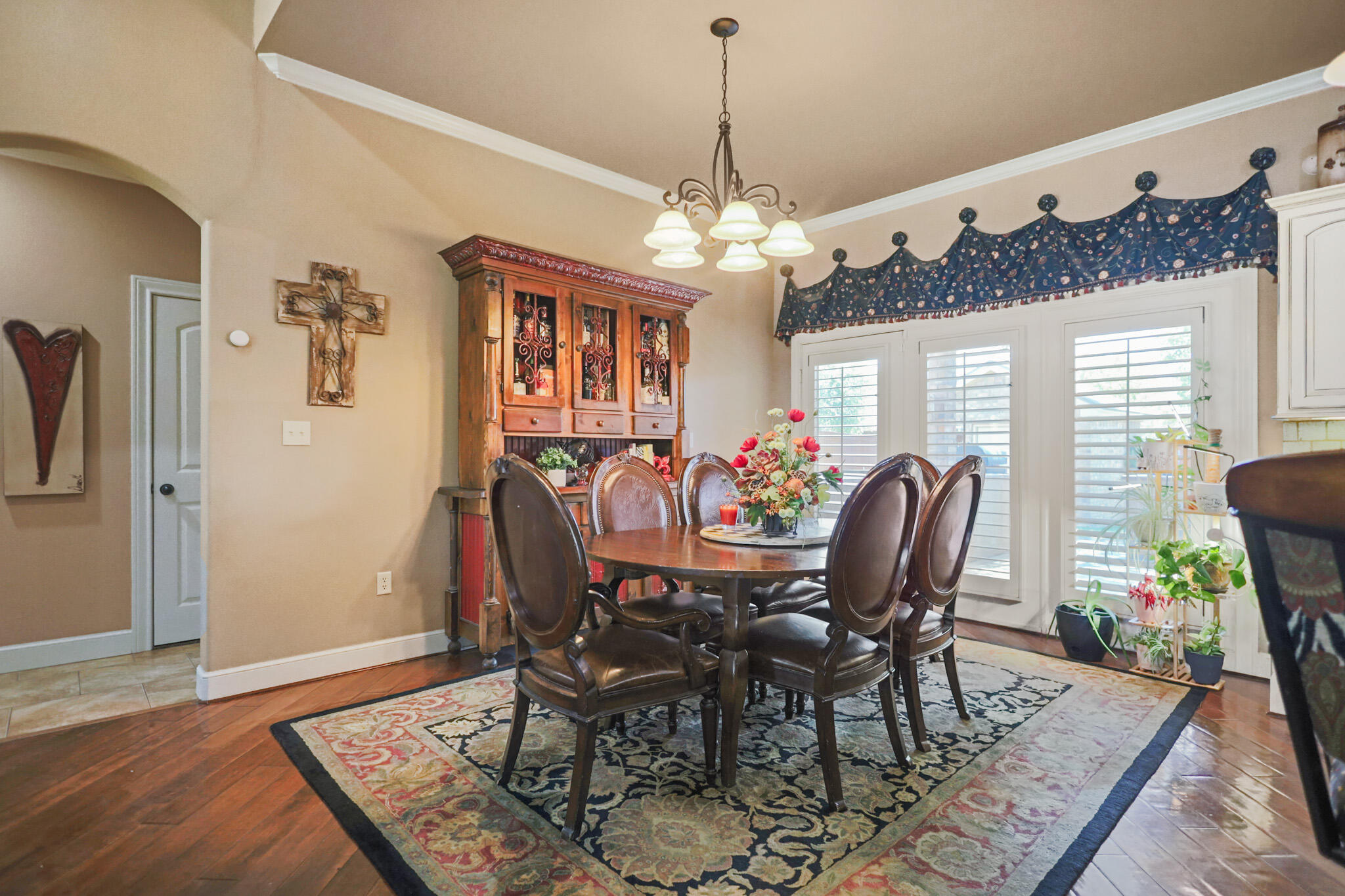 6005 93rd Street Lubbock, TX 79424 - Photo 10 of 31 a view of a dining room with furniture window and wooden floor