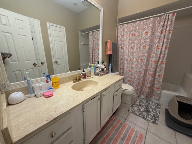 3809 Spicewood Springs Road, Unit 119 Austin, TX 78759 - Photo 6 of 14 The bathroom features a vanity with a light-colored countertop and a built-in sink, along with a mirror