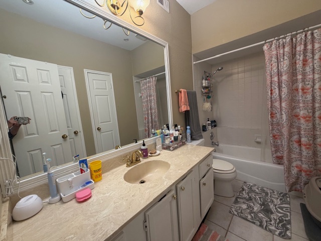 3809 Spicewood Springs Road, Unit 119 Austin, TX 78759 - Photo 7 of 14 The bathroom features a vanity with a light-colored countertop and a built-in sink