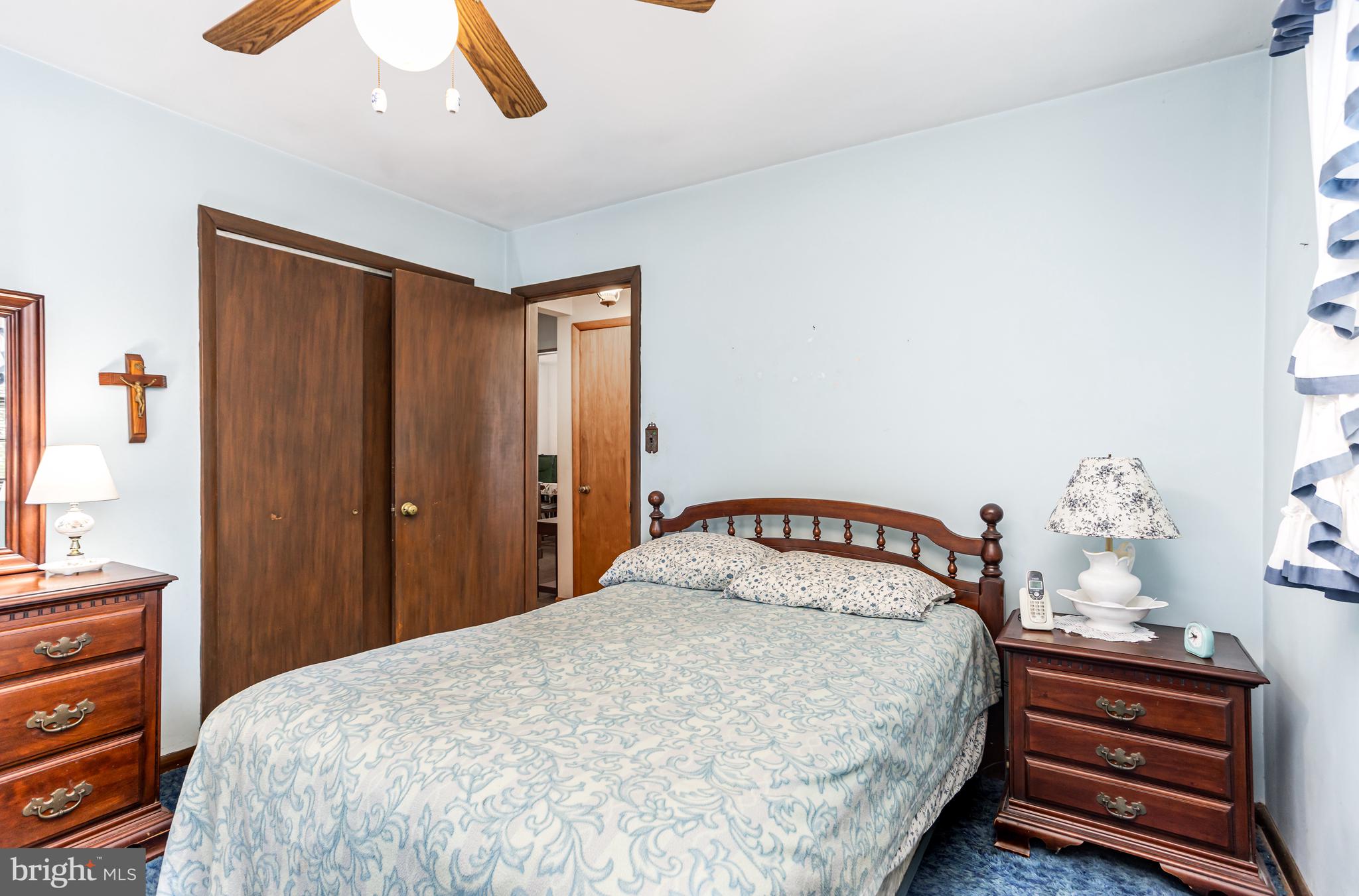 4234 Necker Avenue Baltimore, MD 21236 - Photo 11 of 29 a bedroom with a bed and a chandelier