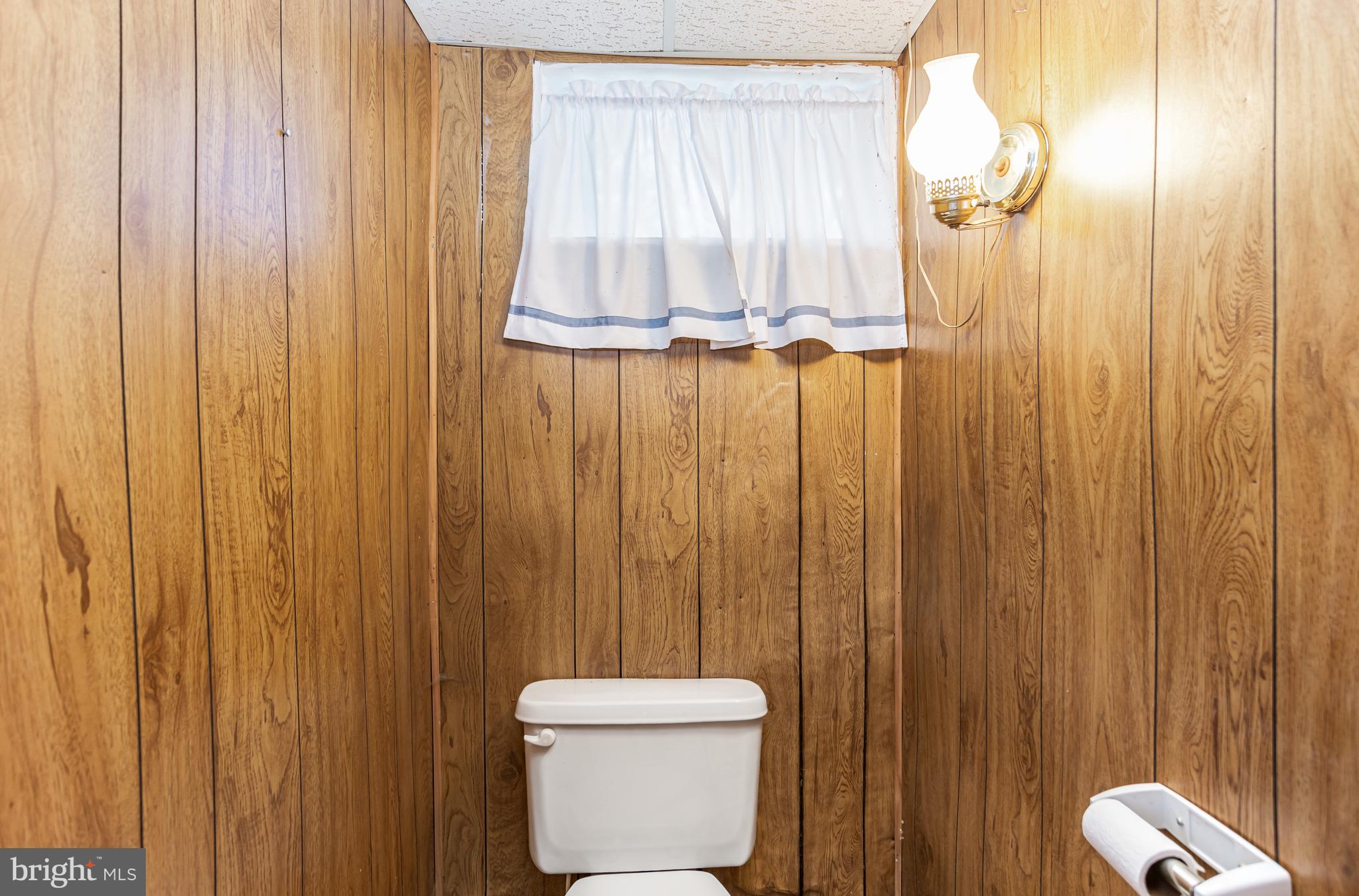4234 Necker Avenue Baltimore, MD 21236 - Photo 19 of 29 a bathroom with a shower curtain