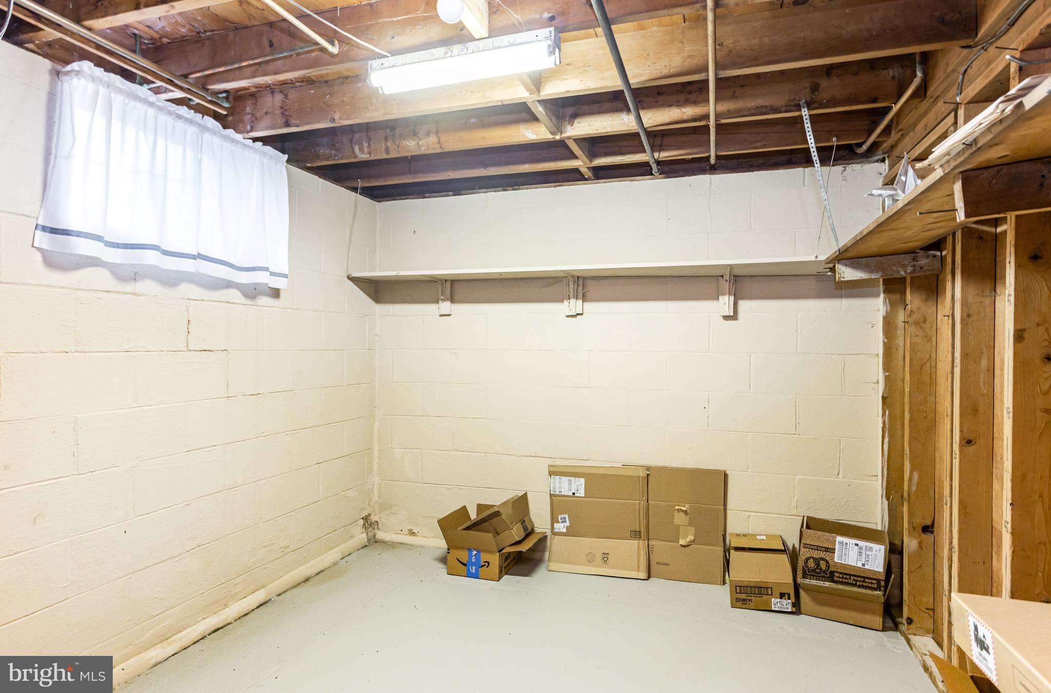 4234 Necker Avenue Baltimore, MD 21236 - Photo 22 of 29 a view of a room with racks on the wall