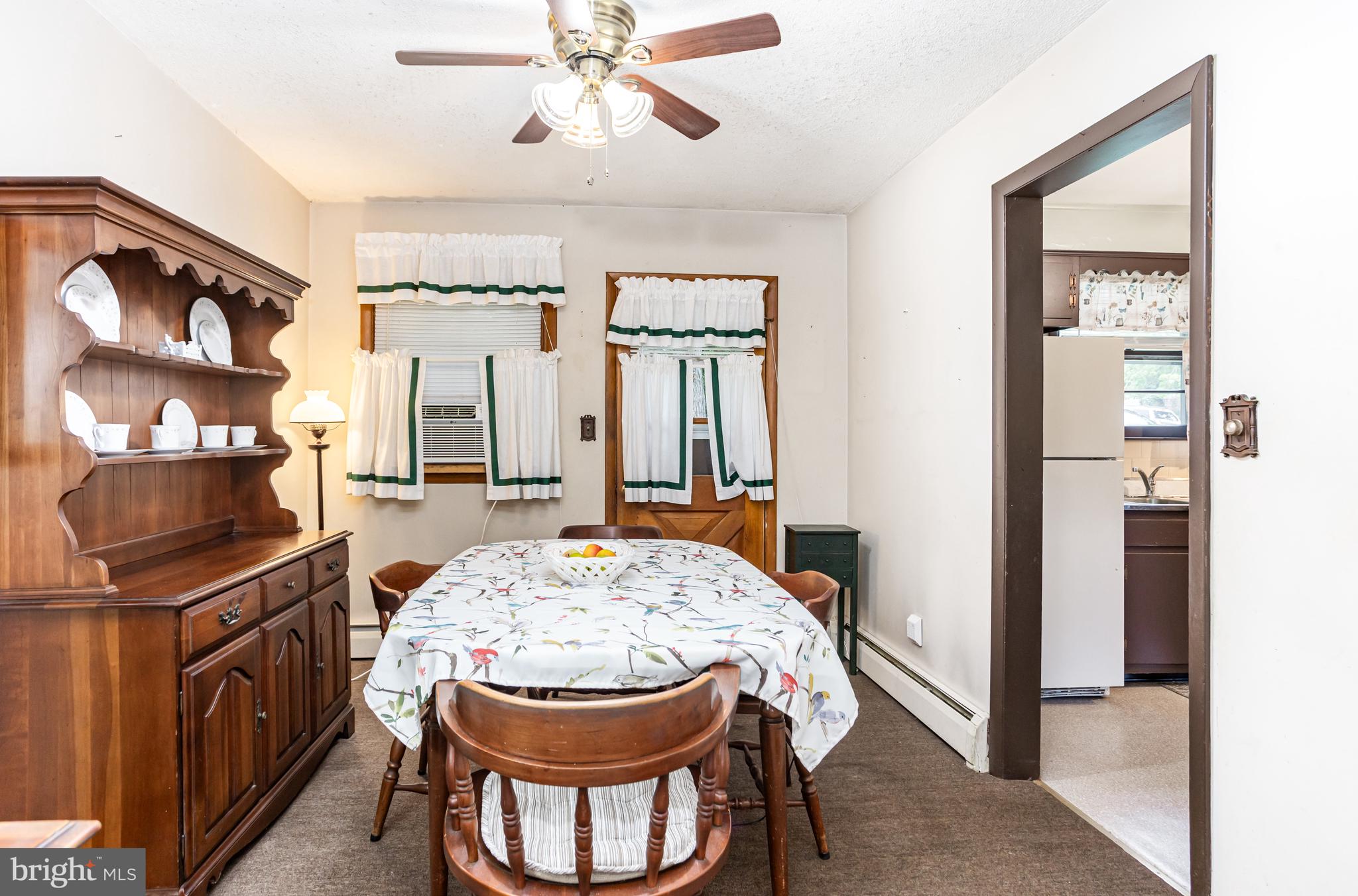 4234 Necker Avenue Baltimore, MD 21236 - Photo 4 of 29 a view of a dining room with furniture