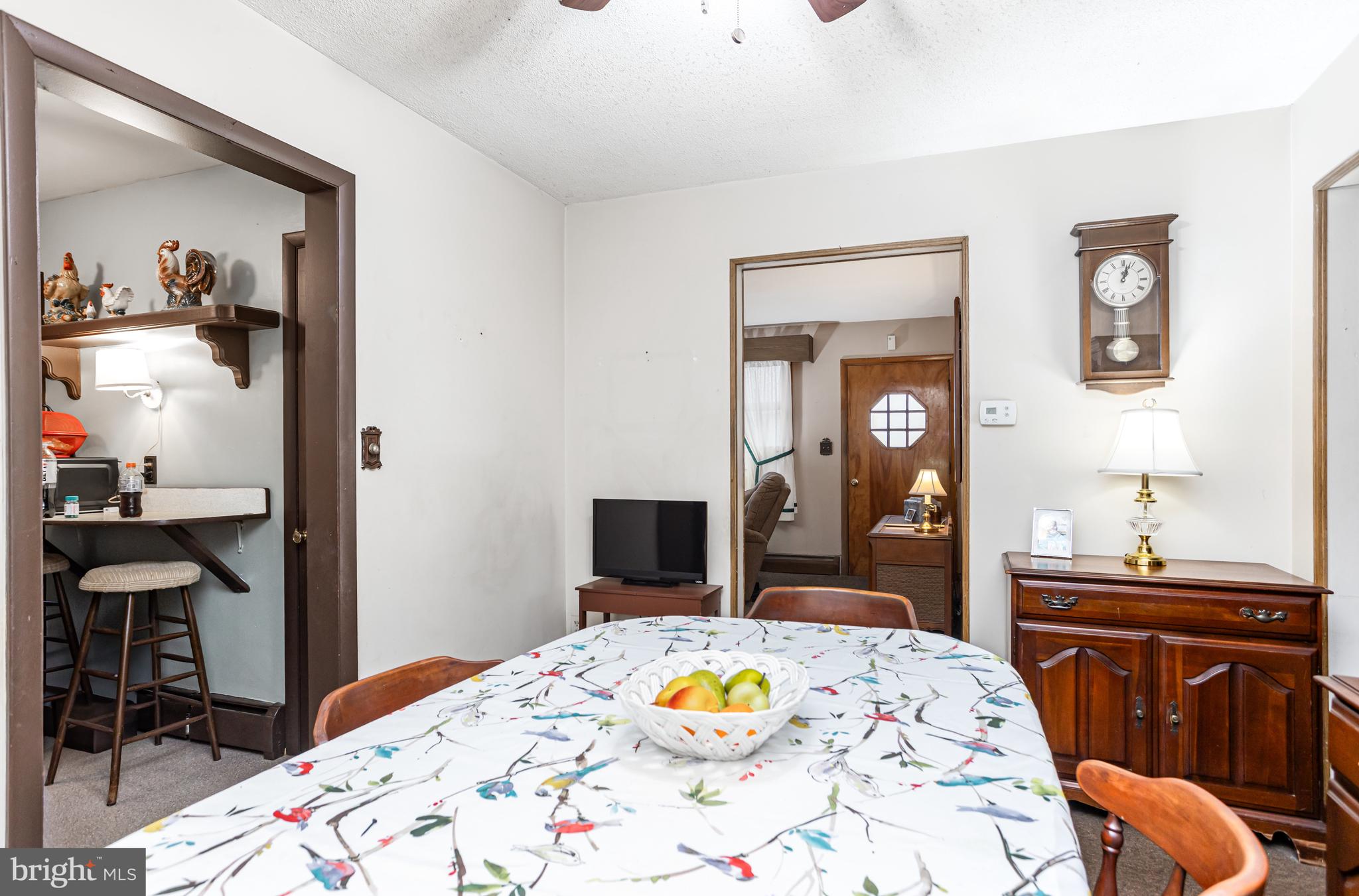 4234 Necker Avenue Baltimore, MD 21236 - Photo 5 of 29 a bedroom with a bed and a table in it