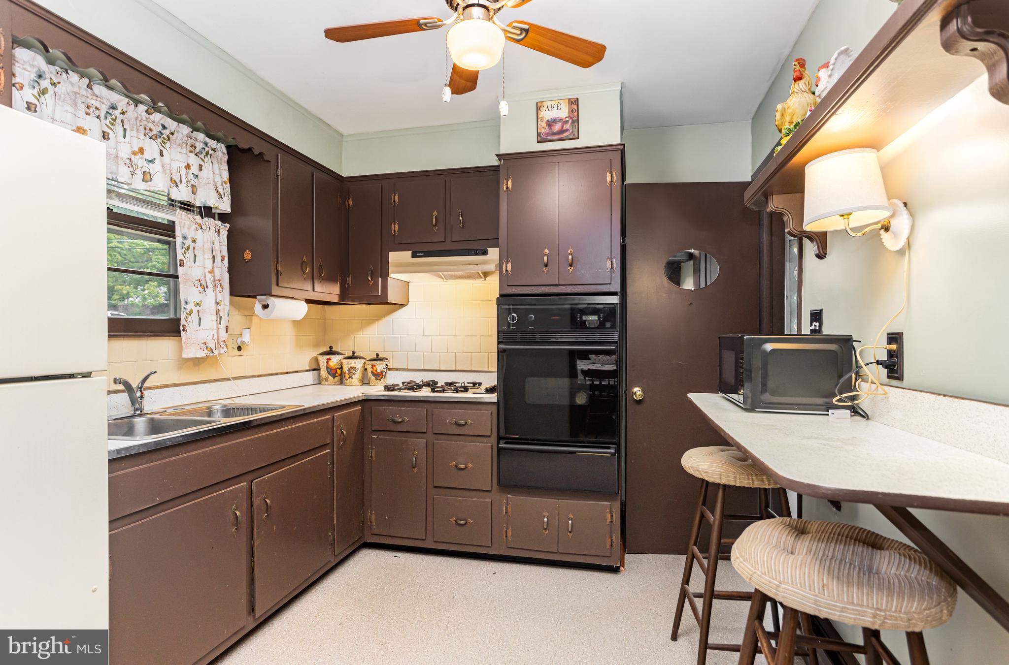 4234 Necker Avenue Baltimore, MD 21236 - Photo 6 of 29 a kitchen with a sink appliances and cabinets