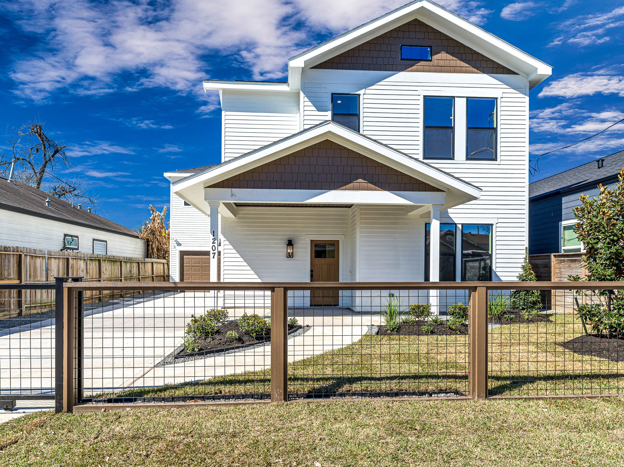 1207 Tabor Street Houston, TX 77009 - Photo 1 of 46 a front view of a house with garden