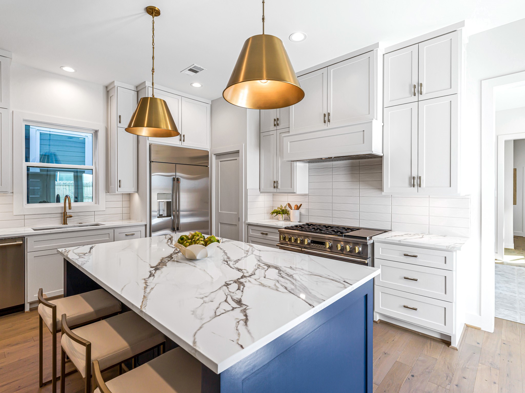 1207 Tabor Street Houston, TX 77009 - Photo 13 of 46 a kitchen with stainless steel appliances a stove a sink a counter space and cabinets
