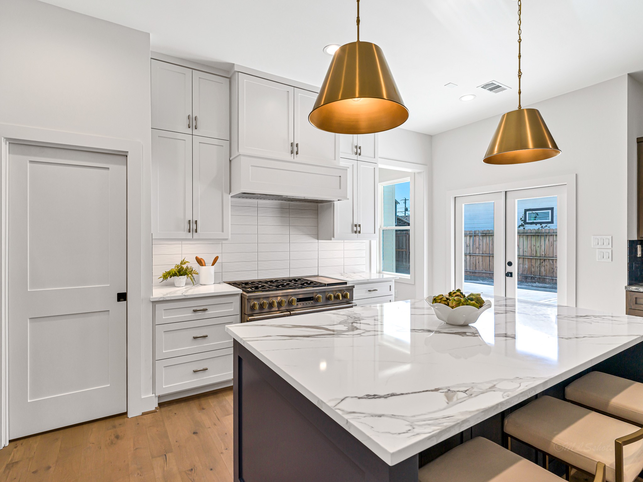 1207 Tabor Street Houston, TX 77009 - Photo 15 of 46 a kitchen with stainless steel appliances granite countertop a sink a stove and a wooden floors