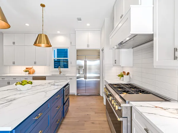 a stove top oven sitting inside of a kitchen