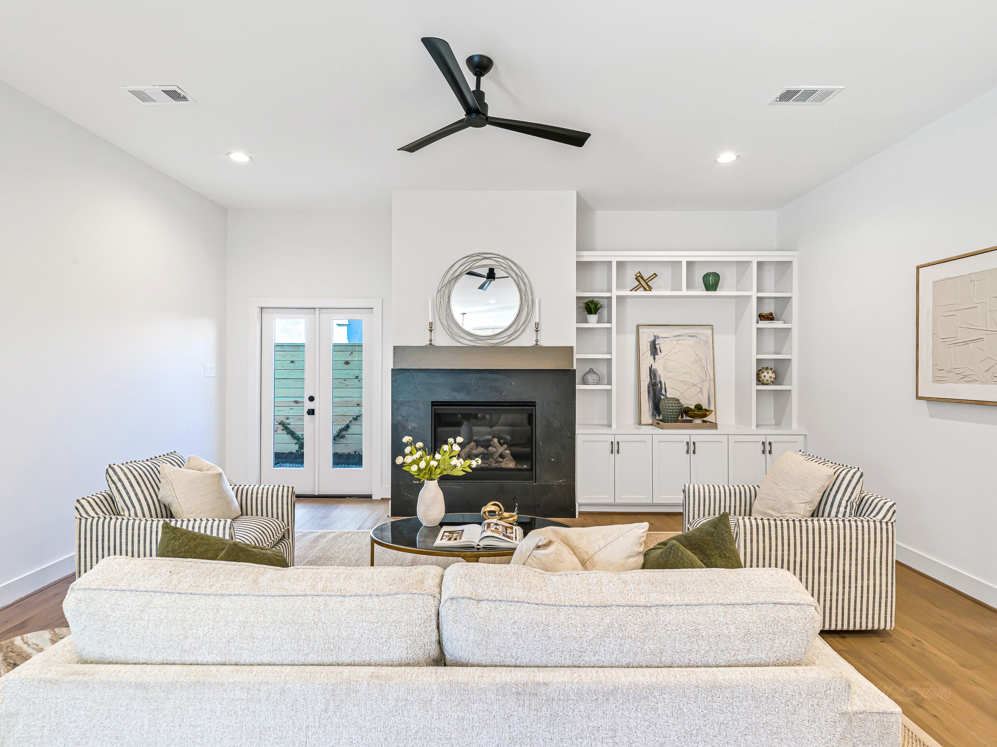 1207 Tabor Street Houston, TX 77009 - Photo 20 of 46 a living room with furniture a clock and a fireplace