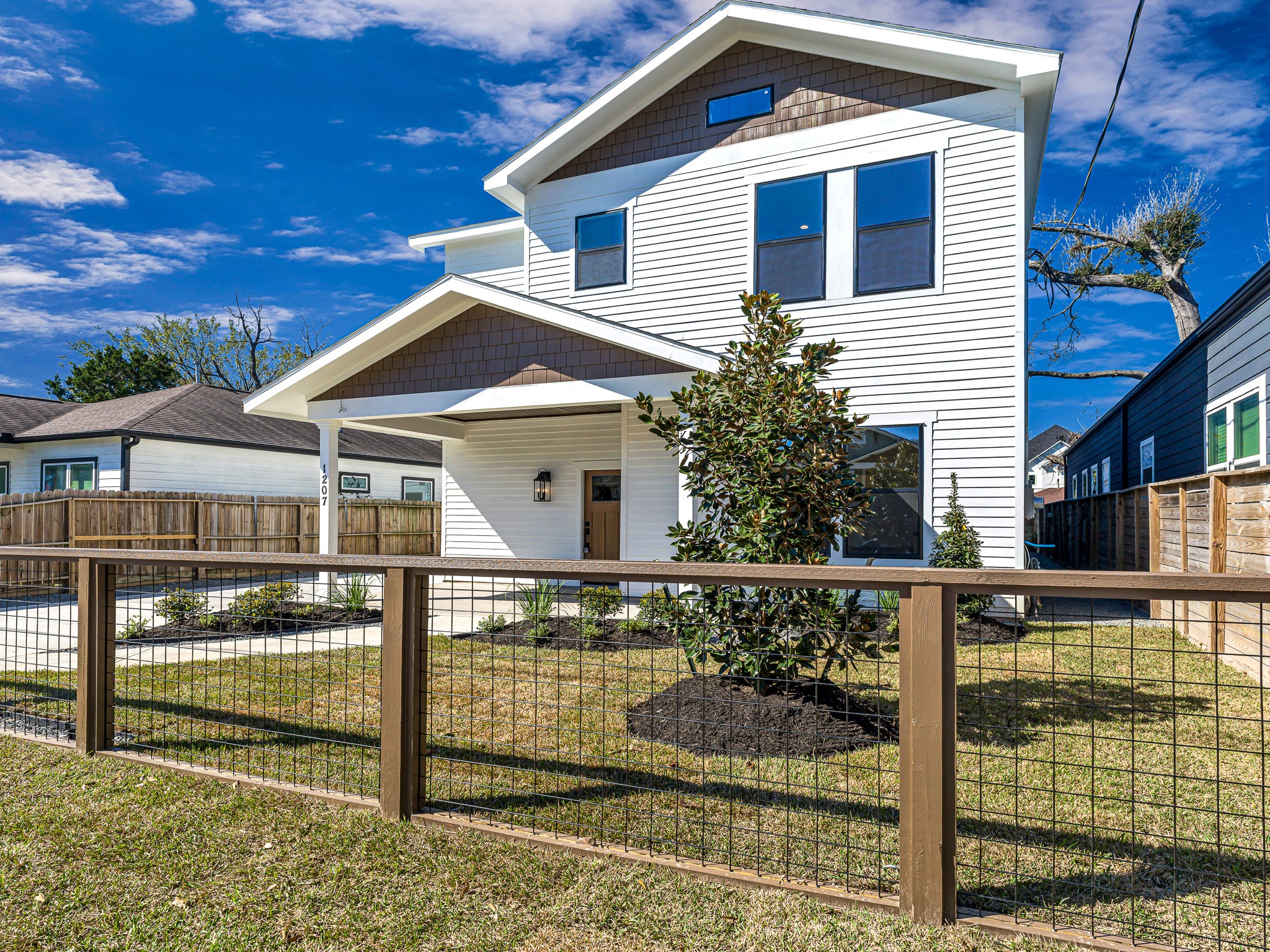 1207 Tabor Street Houston, TX 77009 - Photo 2 of 46 a front view of a house with glass windows