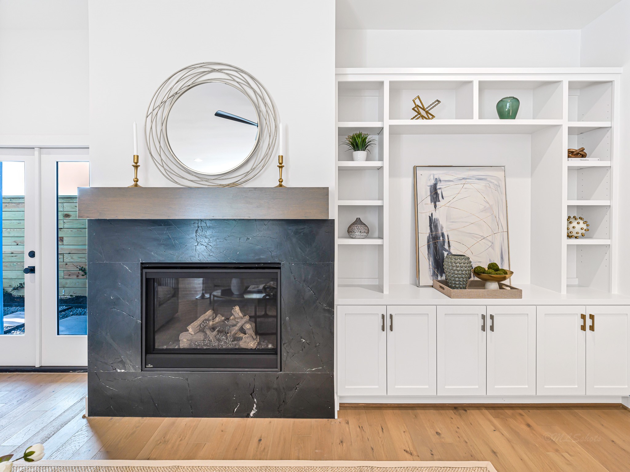 1207 Tabor Street Houston, TX 77009 - Photo 22 of 46 a view of a living room with a fireplace and a wooden floor