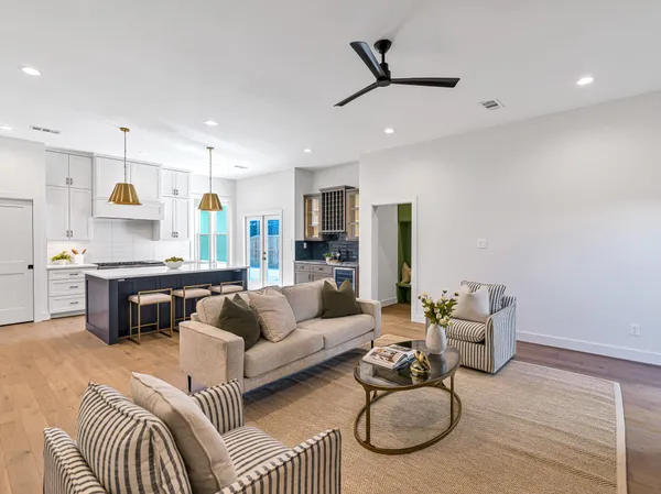 a kitchen with a granite countertop sink and a window