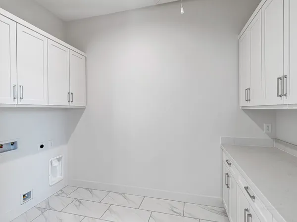 a bedroom with a bed couch and potted plant