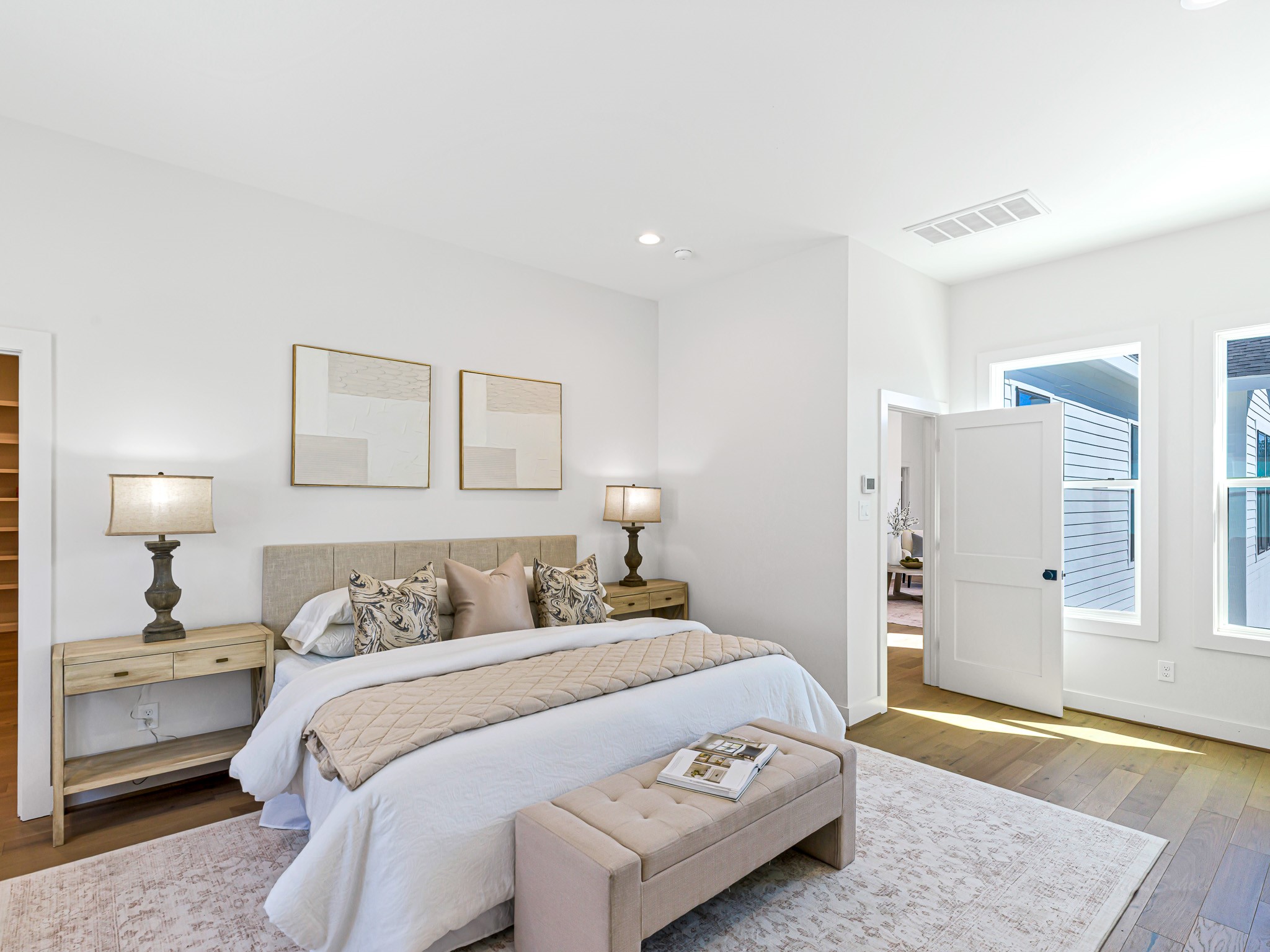 1207 Tabor Street Houston, TX 77009 - Photo 29 of 46 a bedroom with a bed and wooden floor