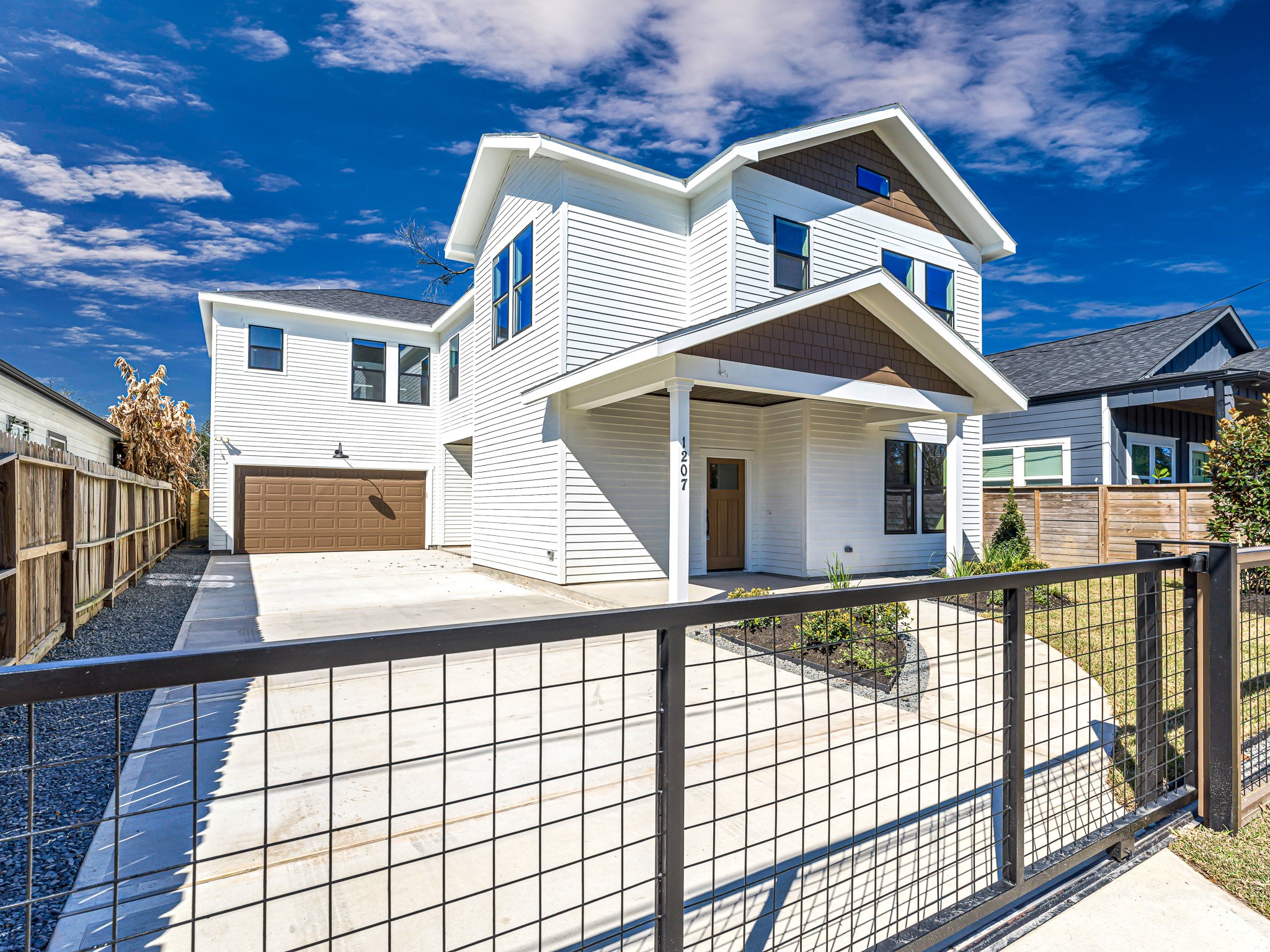 1207 Tabor Street Houston, TX 77009 - Photo 3 of 46 a view of a white house with large windows