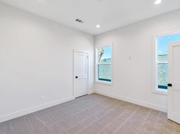 a bathroom with a double vanity sink mirror and
