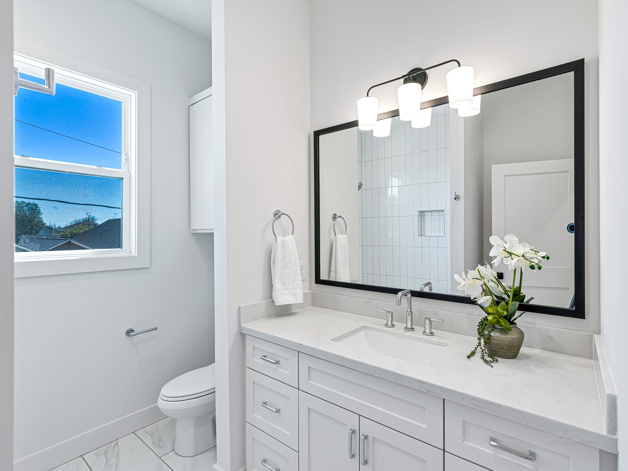 1207 Tabor Street Houston, TX 77009 - Photo 41 of 46 a bathroom with a granite countertop sink a toilet and a mirror