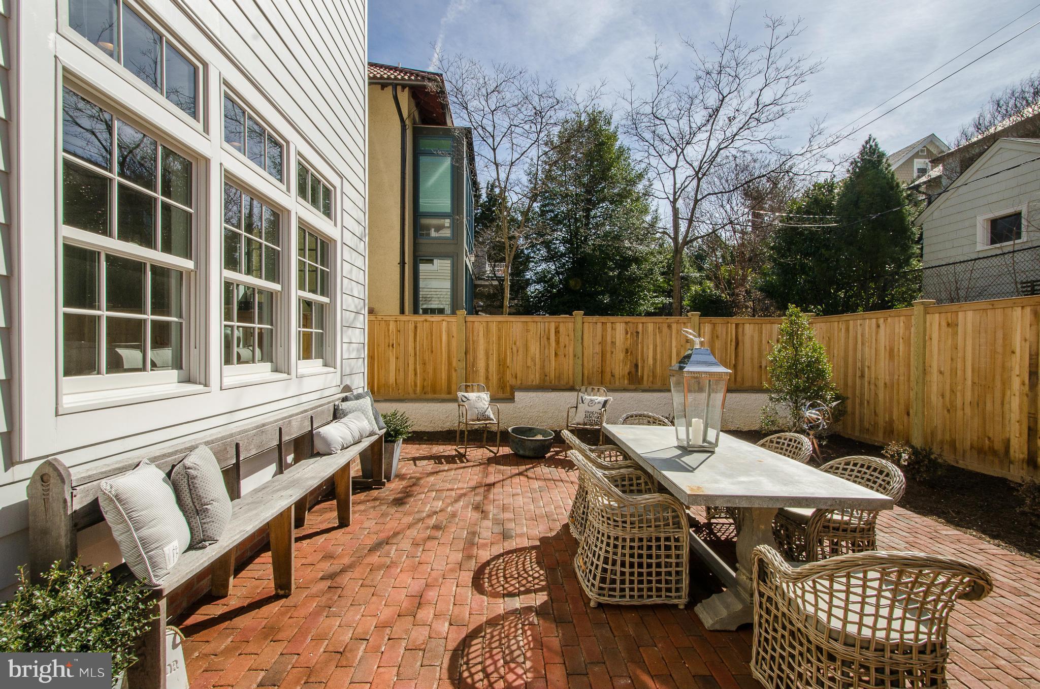 3816 Military Road Northwest Washington, DC 20015 - Photo 20 of 22 a view of a patio with couches table and chairs and potted plants