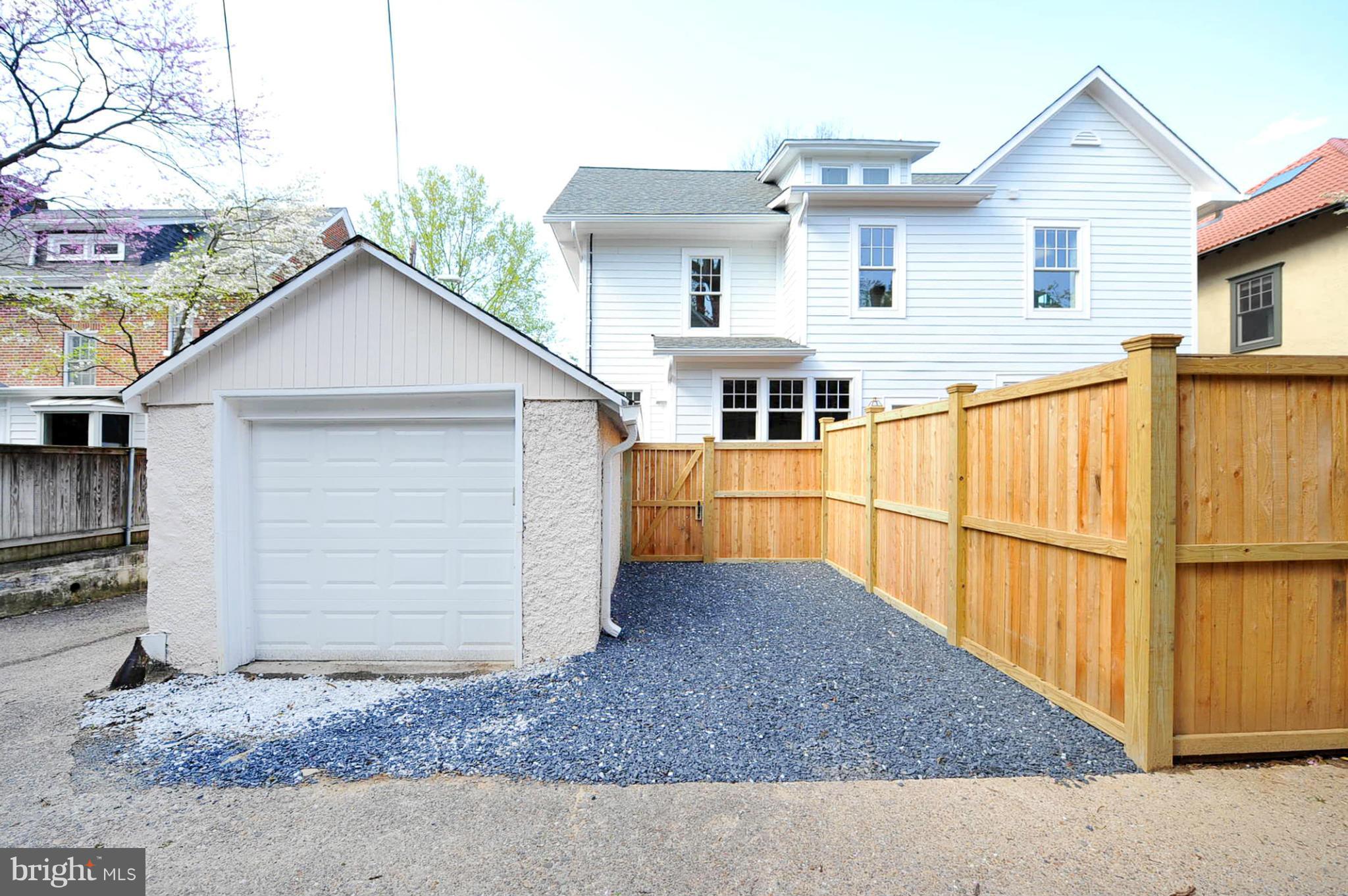 3816 Military Road Northwest Washington, DC 20015 - Photo 21 of 22 a view of a white house with large outdoor space and wooden fence