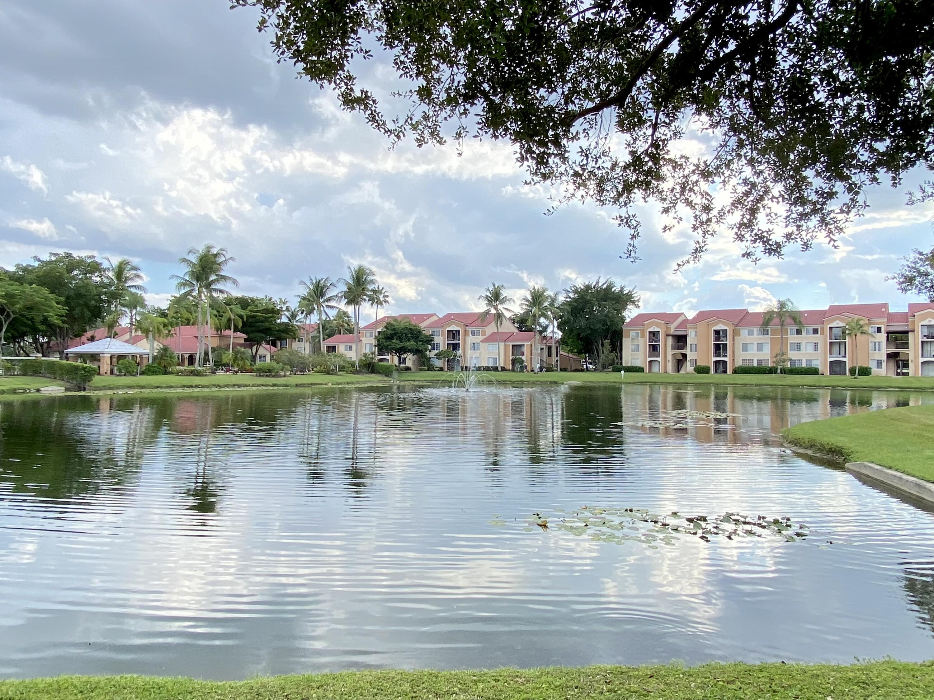 a view of a lake with houses in the back