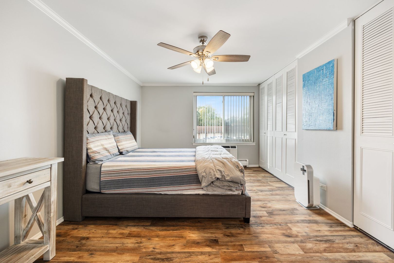 1127 South Old Wilke Road, Unit 203 Rolling Meadows, IL 60005 - Photo 11 of 13 a living room with furniture and a large window