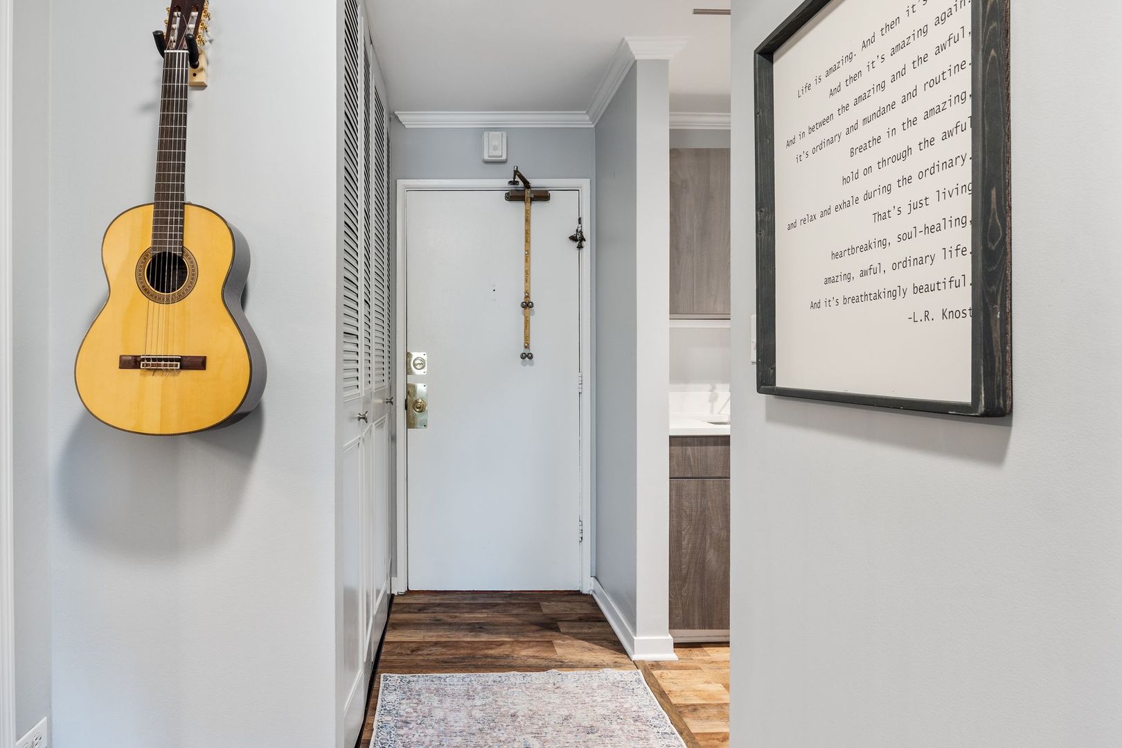 1127 South Old Wilke Road, Unit 203 Rolling Meadows, IL 60005 - Photo 3 of 13 a view of a bathroom with a shower and mirror
