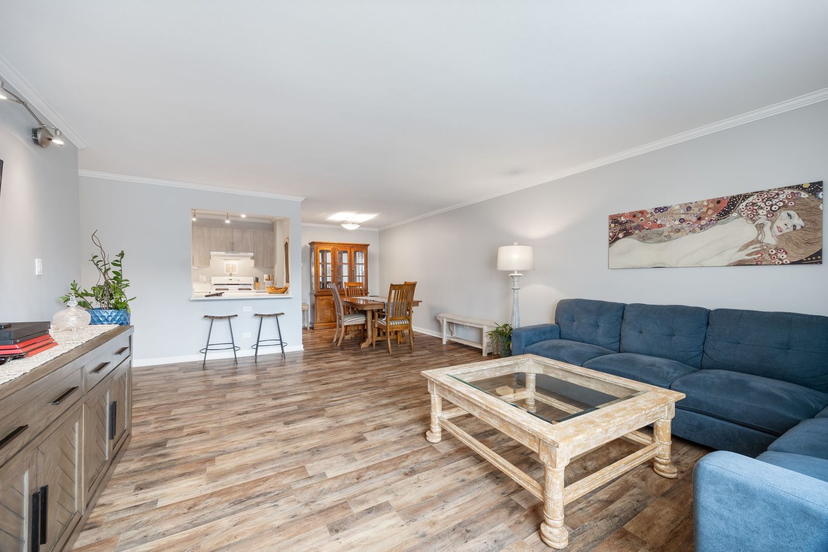 1127 South Old Wilke Road, Unit 203 Rolling Meadows, IL 60005 - Photo 6 of 13 a living room with furniture and wooden floor
