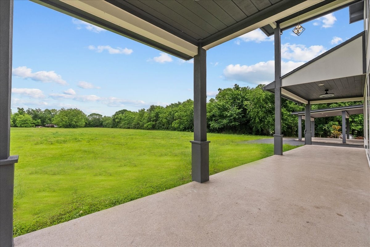 3237 Harkey Road Pearland, TX 77584 - Photo 39 of 46 Covered outdoor patio overlooking the peaceful acreage setting.