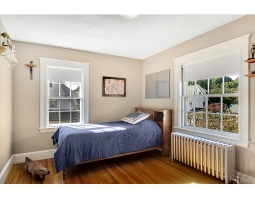 5 Pond Circle Boston, MA 02130 - Photo 22 of 27 a bedroom with a bed and a large window