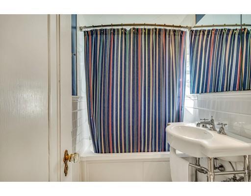 5 Pond Circle Boston, MA 02130 - Photo 24 of 27 a bathroom with a sink and a mirror