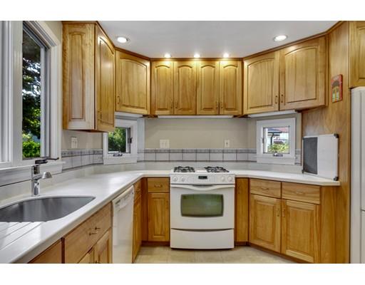 5 Pond Circle Boston, MA 02130 - Photo 8 of 27 a kitchen with a sink stove and cabinets