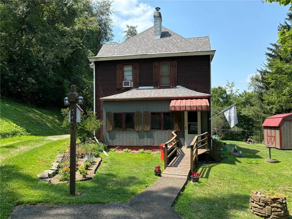 340 Mine Hill Road Adah, PA 15410 - Photo 1 of 23 a front view of a house with garden