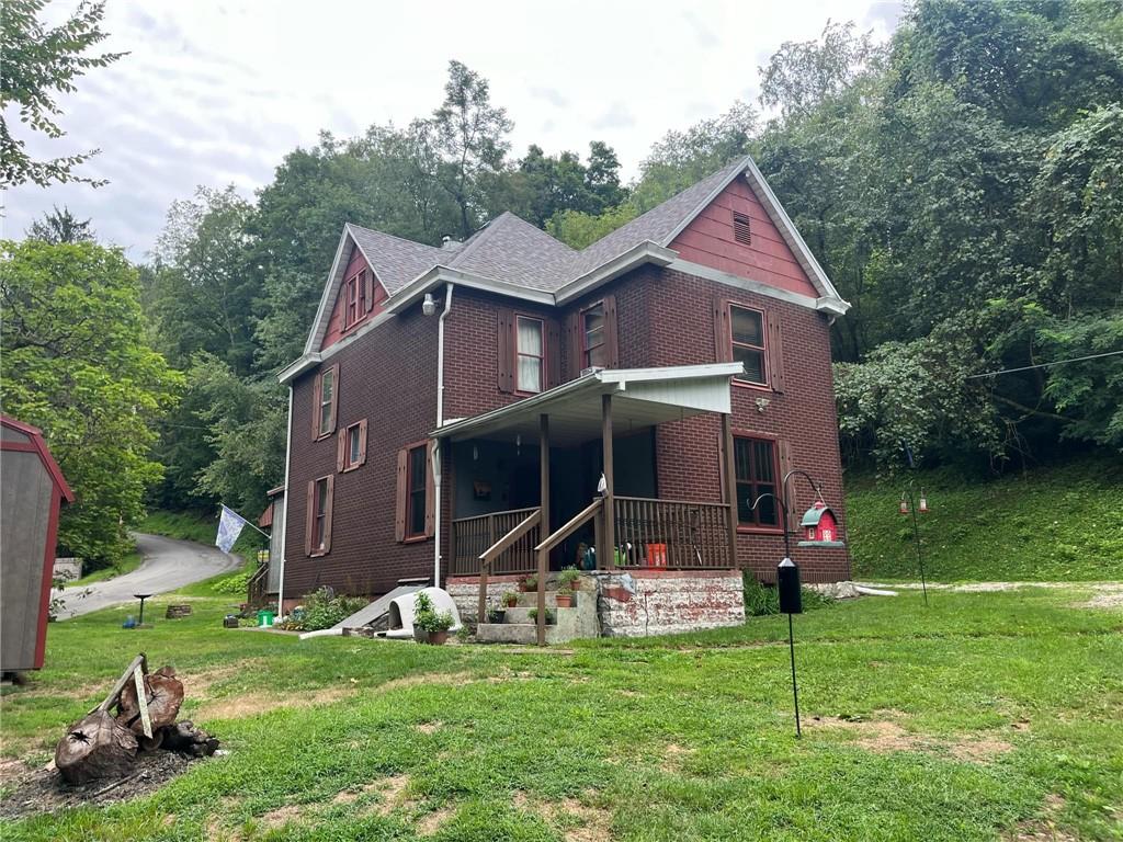 340 Mine Hill Road Adah, PA 15410 - Photo 23 of 23 a front view of house with garden