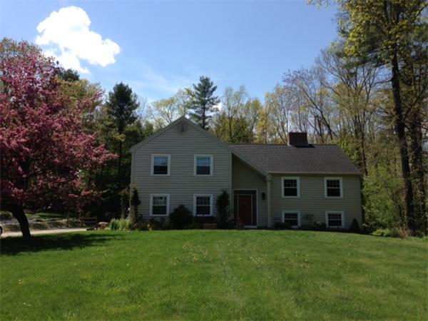 6 Buchan Road Andover, MA 01810 - Photo 1 of 12 a view of a yard in front of a house with large trees